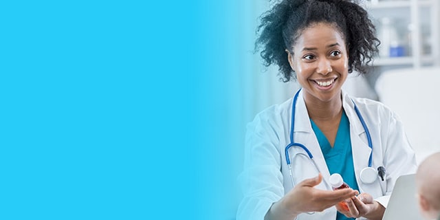 Woman taking to a smiling doctor