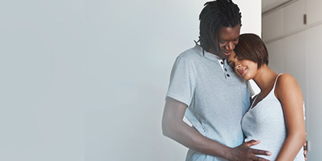 Man holding his pregnant partner
