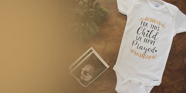 White babygrow with text